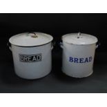 Two cylindrical enamel bread bins.