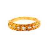 An 18ct gold and diamond half hoop eternity ring, set with nine diamonds, size K/L, 3.7g.