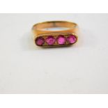 A ruby four stone ring, pave set in yellow metal, size J, 2.4g.
