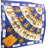 A Hermes Cliquetis blue ground silk scarf, 88cm x 82cm.