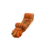 A terracotta brick corbel, of scrolling leaf form, 47cm high