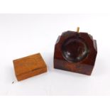 An oak pocket watch holder, 9cm wide, and a travelling pocket watch holder, 6.5cm wide. (2)