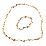 A 9ct gold oval link necklace, on a lobster claw clasp, together with a matching bracelet, 19.5g.