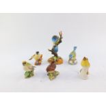 A Royal Crown Derby porcelain figure modelled as a blue tit, Royal Worcester porcelain figures of