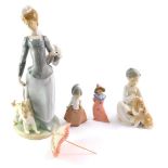 A Lladro porcelain figure modelled as a lady with a dog and parasol, 39cm high (AF), together with a