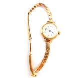 A lady's 9ct gold cased wristwatch, circular white dial bearing Arabic numerals, Swiss movement,