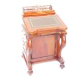A Victorian style mahogany davenport, the galleried rectangular box above a hinged writing slope,