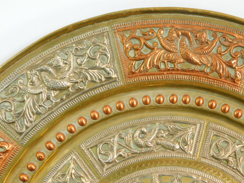 An Indian brass and damascene circular dish, embossed with a Hindu deity surrounded by panels of - Image 3 of 5