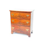 A George III mahogany bow front chest, of three long graduated drawers, raised on bracket feet, 88cm