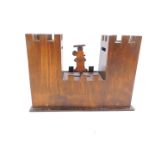 A vintage novelty 1930's wooden Mickey Mouse money box, formed as a castle with two keeps, 23cm