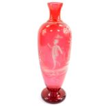 A late 19thC Mary Gregory type cranberry glass vase, decorated with a boy holding a butterfly net,