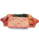 A Tetrad Eastwood red leather and fabric three seater sofa, 256cm wide, together with a matching