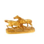 After Pierre-Joules Mene (French 1810-1879). An ormolu figure group of a pair of horses raised on