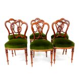 A set of six Victorian rosewood single dining chairs, with carved splat, overstuffed serpentine