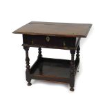 An 18thC oak side table, with single frieze drawer, raised on turned legs, united by an under tier
