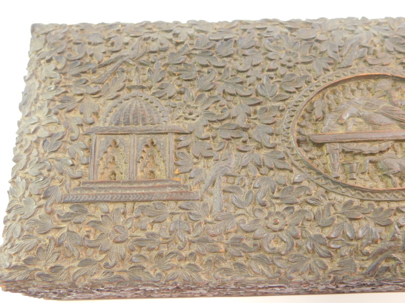 An Anglo Indian 19thC hardwood box, of rectangular form, carved with a recumbent deity, temples, - Image 3 of 7