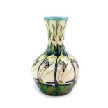 A Moorcroft pottery vase, decorated in The Lily Come Home pattern, by E Bossons, circa 2006, painted