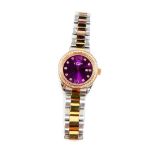 A Rotary lady's bi-coloured stainless steel cased wristwatch, luminescent purple dial, with paste