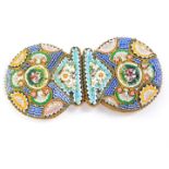 A pair of Italian micro mosaic belt buckles, floral decorated, 9cm diameter (AF).