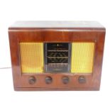 A Bush AC receiver radio type ACII, walnut cased, with Bakelite knops, 50cm wide.