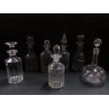 Seven Regency and later cut glass decanters and stoppers, including a pair of Victorian faceted