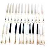 A set of twelve lady's silver handled table knives, decorated in the shell pattern, together with