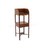 A Georgian style early 20thC mahogany wash stand, the galleried three sided top with washbowl and