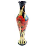 A Moorcroft pottery vase, decorated with stylised red flowers, designed by Kerry Goodwin, limited