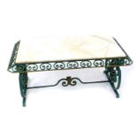 A green and gilt painted cast iron occasional table, with a rectangular white marble top, raised