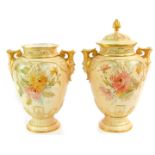 A pair of Royal Worcester blush porcelain vases and covers, c1893, with twin mask handles, painted