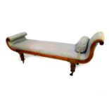 A late Regency mahogany and brass inlaid chaise longue, upholstered in turquoise silk fabric, raised