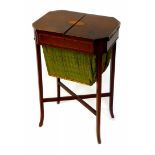 An Edwardian mahogany sewing table, the octagonal top with oval paterae inlay, boxwood and ebony