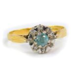 An 18ct gold aquamarine and diamond ring, claw set, size N, 2.9g.