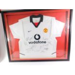 A Manchester Utd signed Vodafone white football shirt, bearing thirteen signatures, c2002/2003,