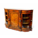 A Victorian walnut and inlaid serpentine credenza, with ormolu and porcelain mounts, with a