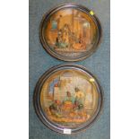 A pair of Musterschutz pottery wall plates, relief decorated with North African scenes, impressed