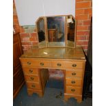 A pine faced desk, or dressing table, with glass top, 123cm high, 882cm wide, 48cm deep, together