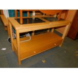 A beech and granite console table, with lower shelf above two drawers, 74cm high, 122cm wide, 48cm