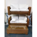A pair of wicker conservatory two seater sofas, with white cotton cushions, 165cm long, together