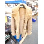 A sheepskin coat, bears a label for Baily's Glastonbury.