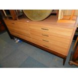 A Lebus teak and teak laminate sideboard, enclosing a cocktail cabinet, with five drawers, 77cm