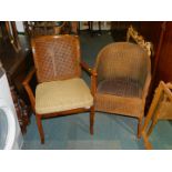 A caned armchair, with cream and gold seat cushion, together with a brown Lloyd Loom tub chair. (2)