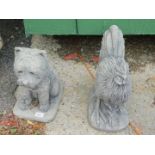 A reconstituted stone figure of a dog, 41cm high, and a cockerel, 49cm high. (2)