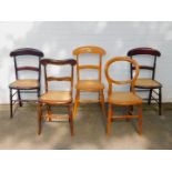 Three Victorian mahogany cane seated bedroom chairs, together with two other Victorian cane seated