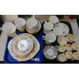 A Colclough porcelain part tea service, decorated with flowers, comprising bread plate, cream jug,