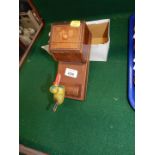 A wooden novelty cigarette box, with marquetry inlay, and fronted by a bird.