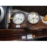 A Smiths oak cased mantel clock, and a further oak cased mantel clock with Westminster chimes. (2)