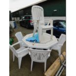 A late 20thC white plastic octagonal garden table, 75cm high, 130cm wide, together with five chairs,