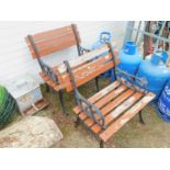 A pair of cast iron garden seats, with wooden slats.