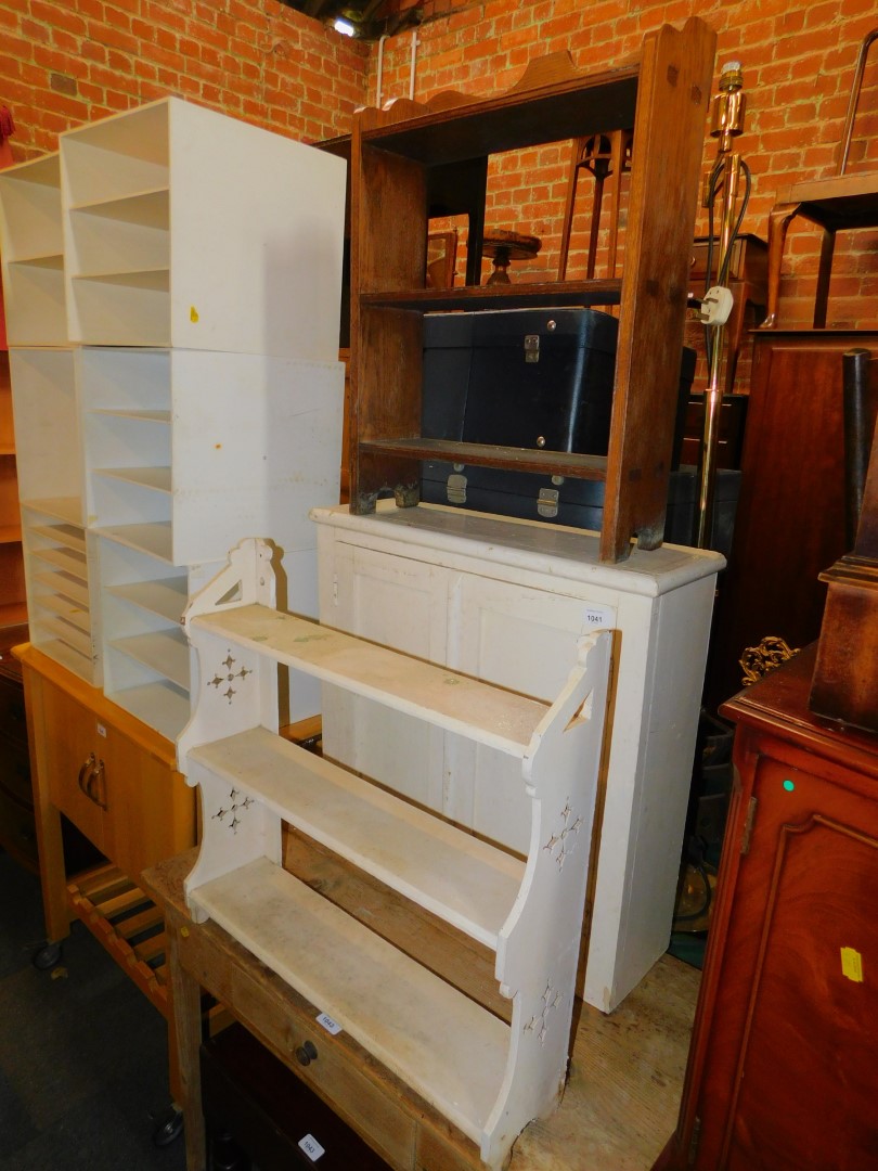 An early 20thC oak wall shelf, 61cm high, 45cm wide, 15cm deep., together with another painted